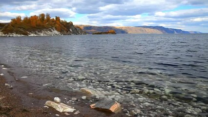 Wall Mural - beautiful autumn landscape of baikal lake on sunny september day. transparent, clean water on the be