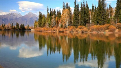 Wall Mural - scenic autumn landscape with yellowed trees on banks of irkut river and mountains of eastern sayan i
