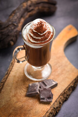 Hot chocolate cocoa with whipped cream on table