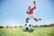 © Beaunitta V W/peopleimages.com - Soccer ball kick, sport and man athlete ready for team exercise, fitness and exercise game training. Football workout of a soccer player playing sport on an field in nature for cardio and wellness