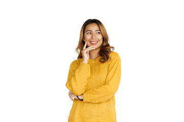 Sticker - Attractive positive young asian brunette woman in yellow sweater on white background.