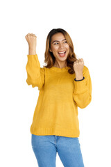 Sticker - Attractive positive young asian brunette woman in yellow sweater on white background. gladful, happy, win, victory