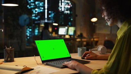 Fototapete - Middle Eastern Female Working in Creative Agency, Implementing Modern Business Strategy for Clients. Successful Specialist Using Laptop Computer with Green Screen Mock Up Display.
