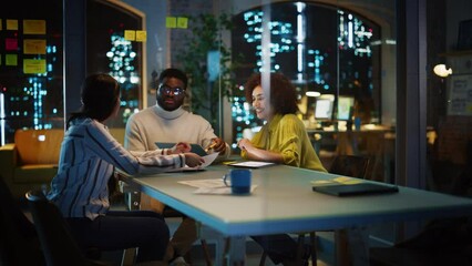 Poster - Excited Marketing Manager Leading a Team Meeting in Creative Office Conference Room in the Evening. Confident Multiethnic Female Discussing a New Project Plan with Agency Employees.