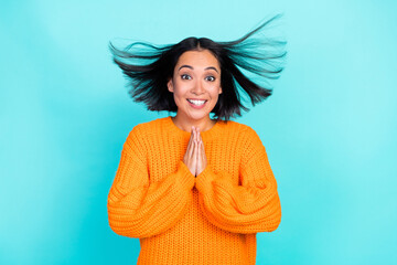 Sticker - Photo of funny shiny young lady wear orange sweater wind blowing arms together isolated turquoise color background