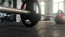 Videotape Of A Barbell On The Floor In A Gym.