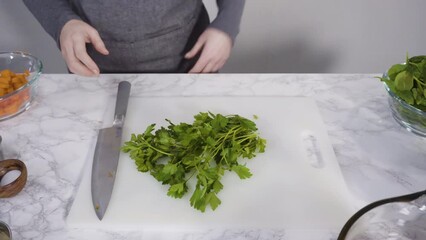 Poster - Curring vegetables on a white cutting board to cook vegetarian white bean soup.