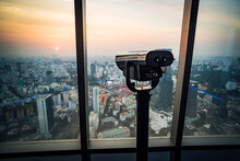 Binoculars Or Telescope On Top Of Skyscraper At Observation. Device For Sightseeing From The Top Of A Skyscraper. Saigon Or Ho Chi Minh City. Vietnam.