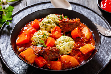 Beef Stew with Dumplings in bowl, top view