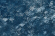 Real photographic macro image of snowflakes in a snowdrift, toned in blue