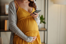 Pregnant Woman Texting Doctor