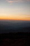 Fototapeta Na ścianę - View on mountains by the lights of sunset