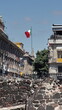 © Angela - Mexican flag above the Templo Mayor in Mexico City