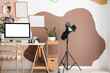 © Pixel-Shot - Interior of stylish office with photographer's workplace and equipment