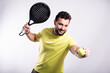 © FotoAndalucia - Man plays paddle tennis and poses in studio photos on white color background