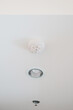 Smoke sensor detector mounted on roof in home or apartment. Safety and conflagration security concept