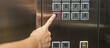 Hand finger press the Elevator button, woman using Elevator in office or apartment