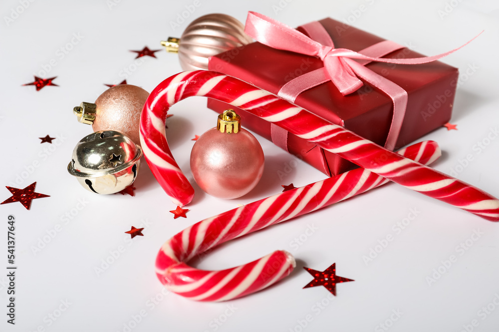 Candy canes, Christmas gift and decorations on white background, closeup
