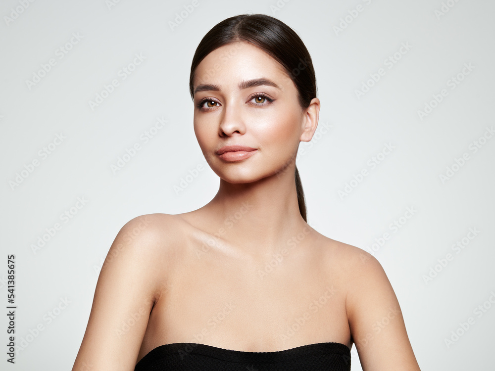 Beautiful Young Woman with clean fresh skin look away. Girl beauty face ...