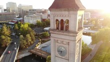 Aerial Footage Of The Sunset Beaming Through The Clock Tower, Located In Spokane, Washington