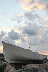 Wall Mural - picturesque view of sky with heavy clouds and boat on coast