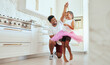 © Jade Maas/peopleimages.com - Dad, girl and ballet dance of a child in a home kitchen dancing together and bonding. Family man, father and kid dancer having fun and spending quality time with care happy from a crazy twirl