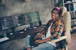 © deagreez - Photo of smiling happy guy dressed eyewear hat chatting modern device indoors workstation workshop home