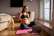 © Monkey Business - Pregnant Woman Wearing Fitness Clothing With Laptop At Home Doing Online Yoga Class