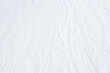 © fotoyou - Top view of white ski tracks pattern on snow background.