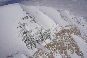 Wall Mural - Scenic view of the snowy peak of Mountain against blue sky