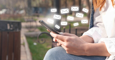 Wall Mural - woman sending email by smartphone.