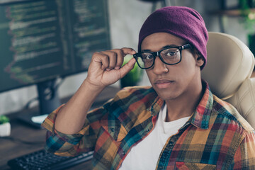 Photo of confident cool guy dressed eyewear hat working front end engineer modern device indoors workstation workshop home