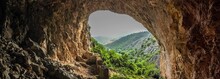 Lush Green Vegetation Of A Mountain Seen Through The Opening Of Peshna Cave In Macedonia