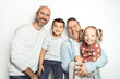 Happy two man couple with two adopted childs on white background