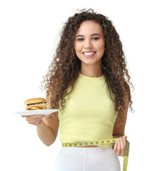 Wall Mural - Happy young African-American woman with measuring tape and burger on white background. Diet concept