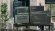 © DC Studio - Computer screens on desk in empty data room displaying program code and algorithms, developing new user interface. Agency network servers with cloud computing script in software it office.
