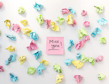 Miss You Note Handwritten On A Pink Sticky Note With A Decorated Background