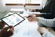 © Jirapong - Asian entrepreneurs and business people meeting in a conference room in business planning, financial budget and investment risk assessment to analyze customer groups to increase company growth