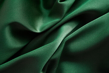 Background from green silk satin fabric texture 