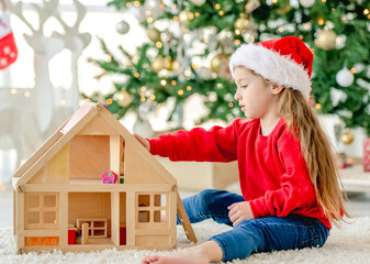 Wall Mural - Little girl in Christmas time