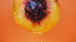 canvas print picture - cut peach with juice dripping on an orange background