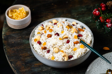 Traditional Christmas kutia. Boiled rice porridge. traditional Slavic holiday ritual dish. Sweet pilaf with nuts. Kutya Ukrainian. Orthodox christmas