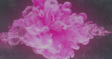 Color explosion. Ink water splash. Fantasy vapor. Neon pink fluid drop floating on dark glitter mist cloud texture abstract art background.
