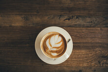 White Cup With Fresh Cappuccino On Wooden Background