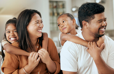 Wall Mural - Happy, smile and children hugging their parents while sitting together in the living room at home. Happiness, love and girl kids embracing their mother and father while bonding and relaxing at house.