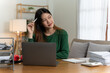© PaeGAG - Asian girl with laptop computer on desk.