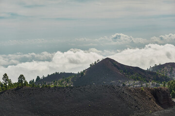 Seas of clouds, lava flows, the Teide of Tenerife in the background and many more spectacular landscapes on the route of the volcanoes (Cumbre Vieja) on the island of La Palma. Canary Islands. Spain