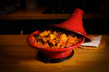 Moroccan Tagine In A Red Pot Dish On A Kitchen Table