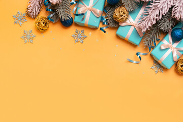 Wall Mural - christmas background with pine tree, gifts and festive decorations top view. christmas flat lay. cop