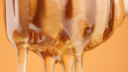Poster - A Honey Dipper Drizzling honey, macro shot. Honey dripping, pouring from wooden dipper close up. Healthy organic honey